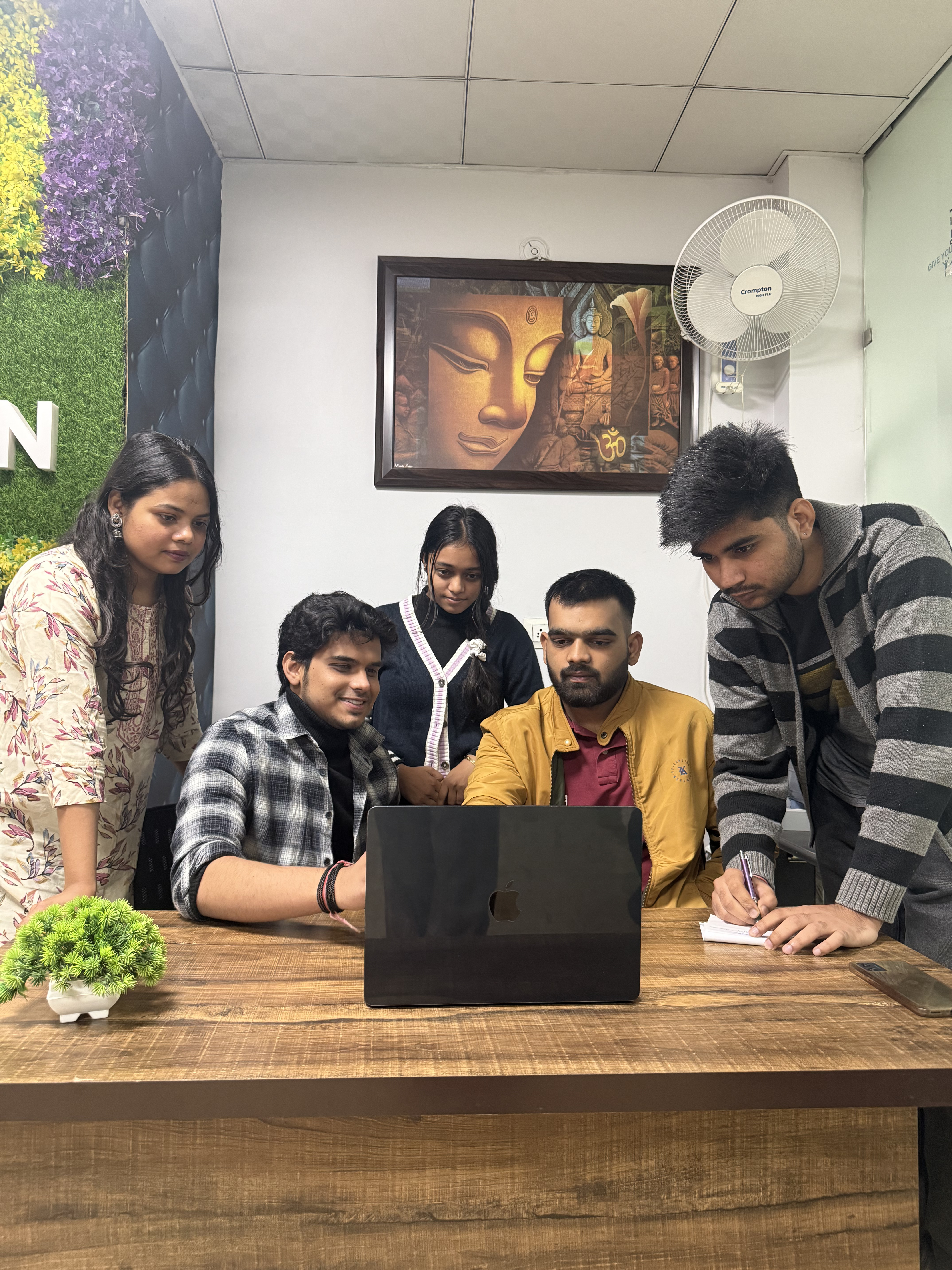 Team discussing mobile app designs on a wall display