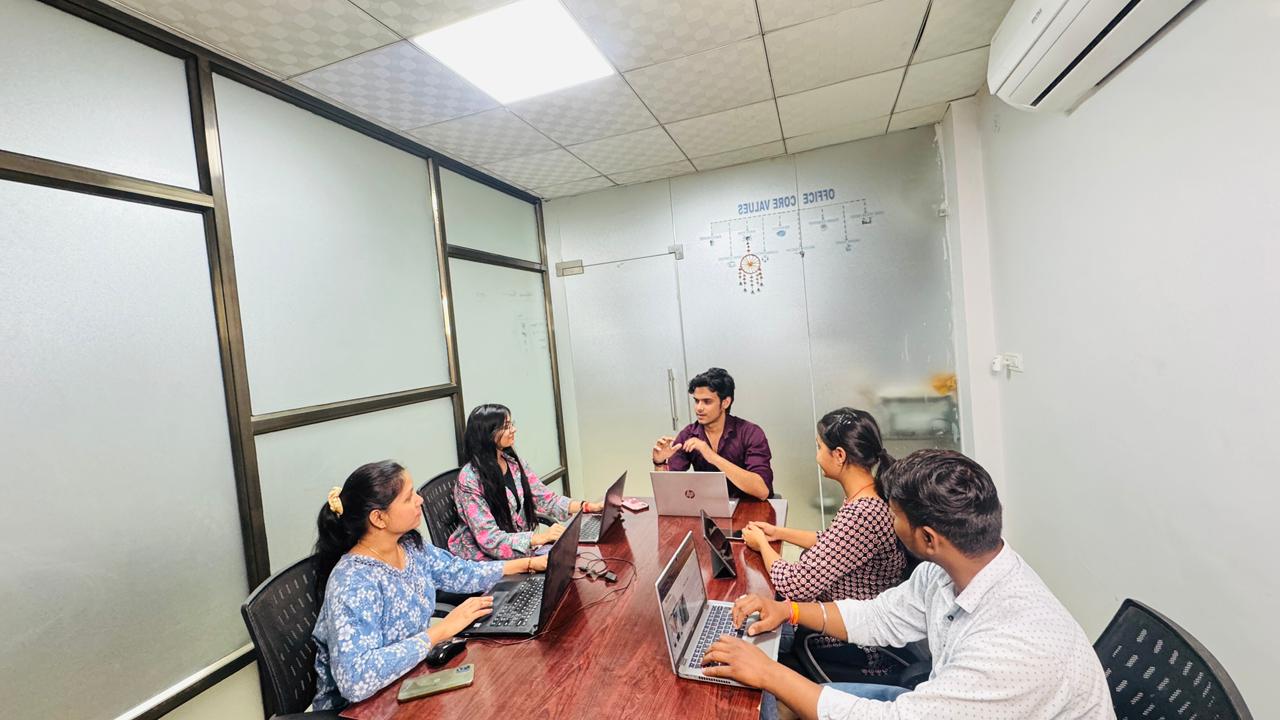 Team planning a system architecture in front of a large display
